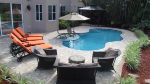 curved swimming pool in South Florida backyard